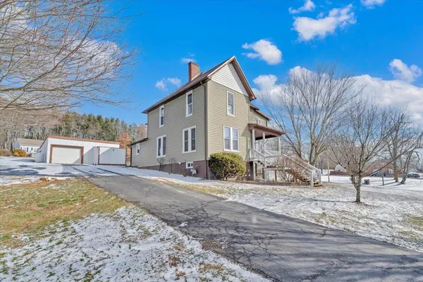 a view of a house with a yard