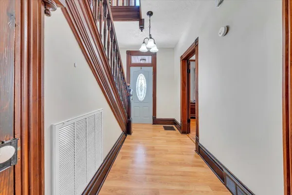 a living room with furniture or couch and a chandelier