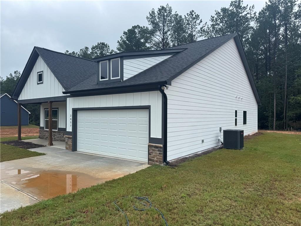 2057 North Hicks Road Toccoa, GA 30577 - Photo 2 of 22 a front view of a house with a yard and garage