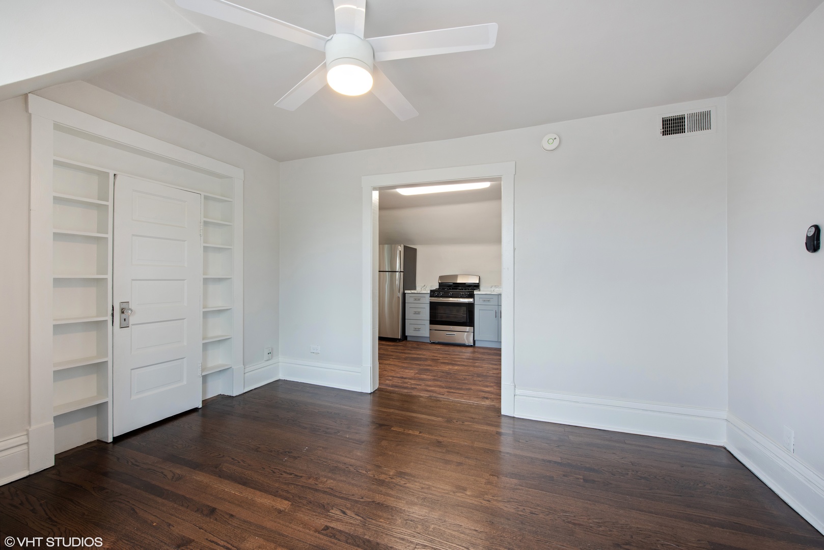 Undisclosed Address Chicago, IL 60630 - Photo 3 of 7 an empty room with wooden floor closet and windows