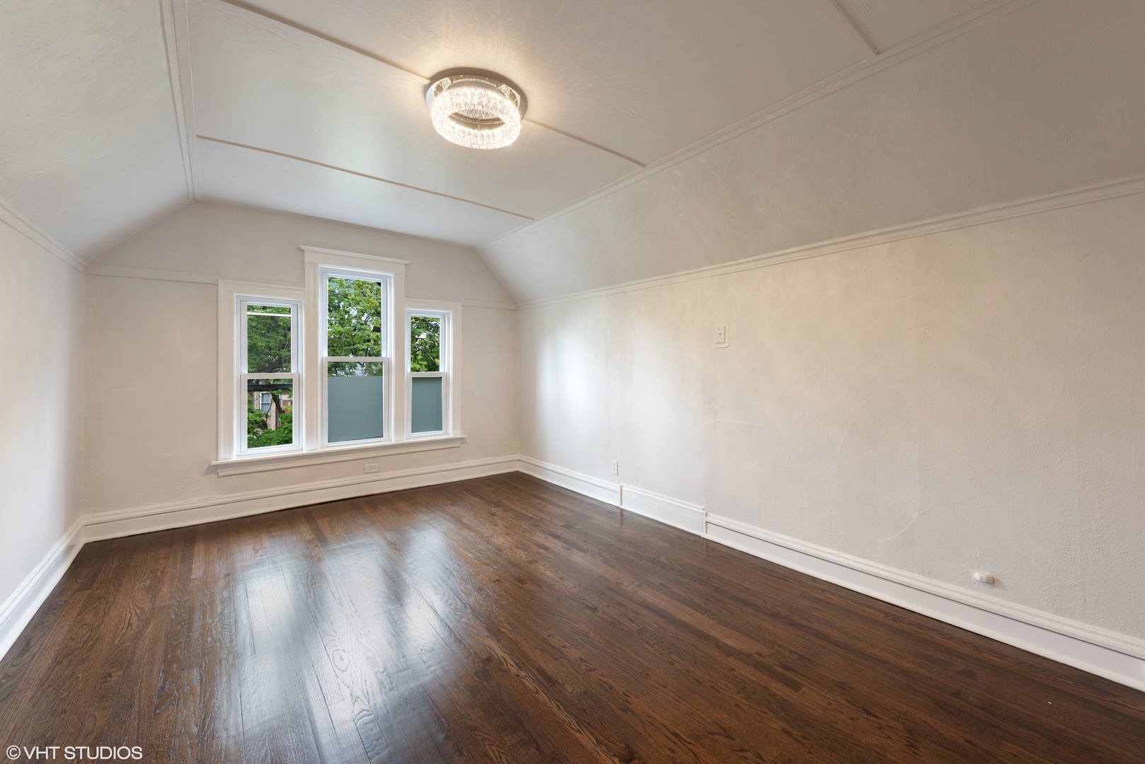 Undisclosed Address Chicago, IL 60630 - Photo 5 of 7 an empty room with wooden floor and windows