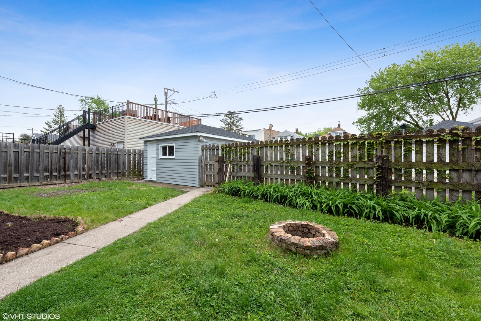 Undisclosed Address Chicago, IL 60630 - Photo 7 of 7 a view of a house with backyard and a garden