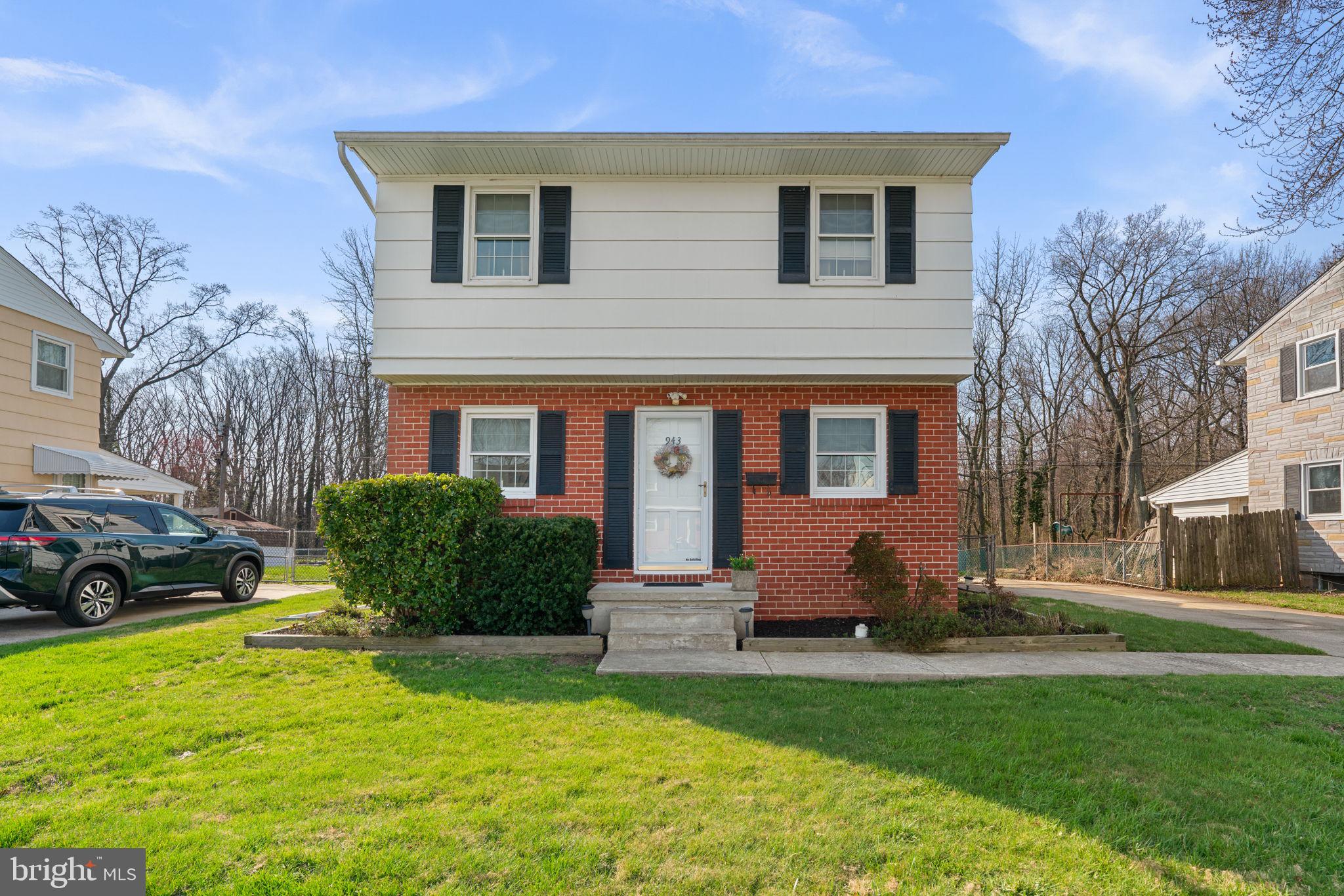 943 Homberg Avenue Baltimore, MD 21221 - Photo 2 of 34 a front view of a house with a yard
