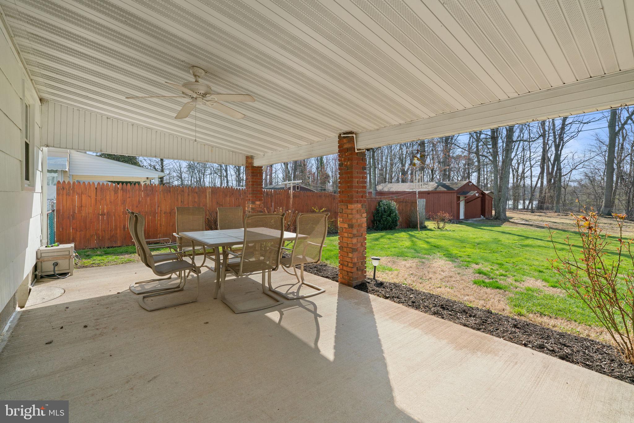 943 Homberg Avenue Baltimore, MD 21221 - Photo 27 of 34 a view of a patio with a table chairs and a patio