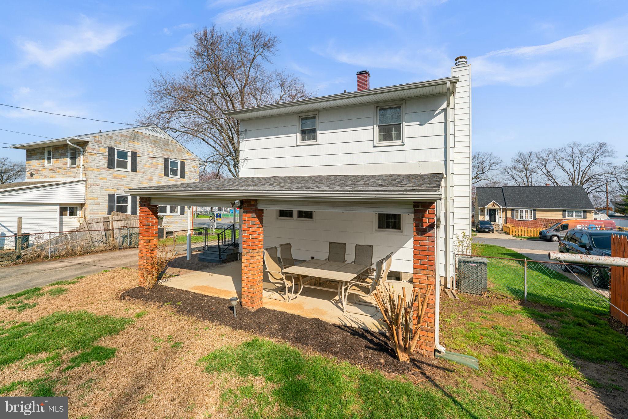 943 Homberg Avenue Baltimore, MD 21221 - Photo 30 of 34 a view of a house with backyard porch and sitting area