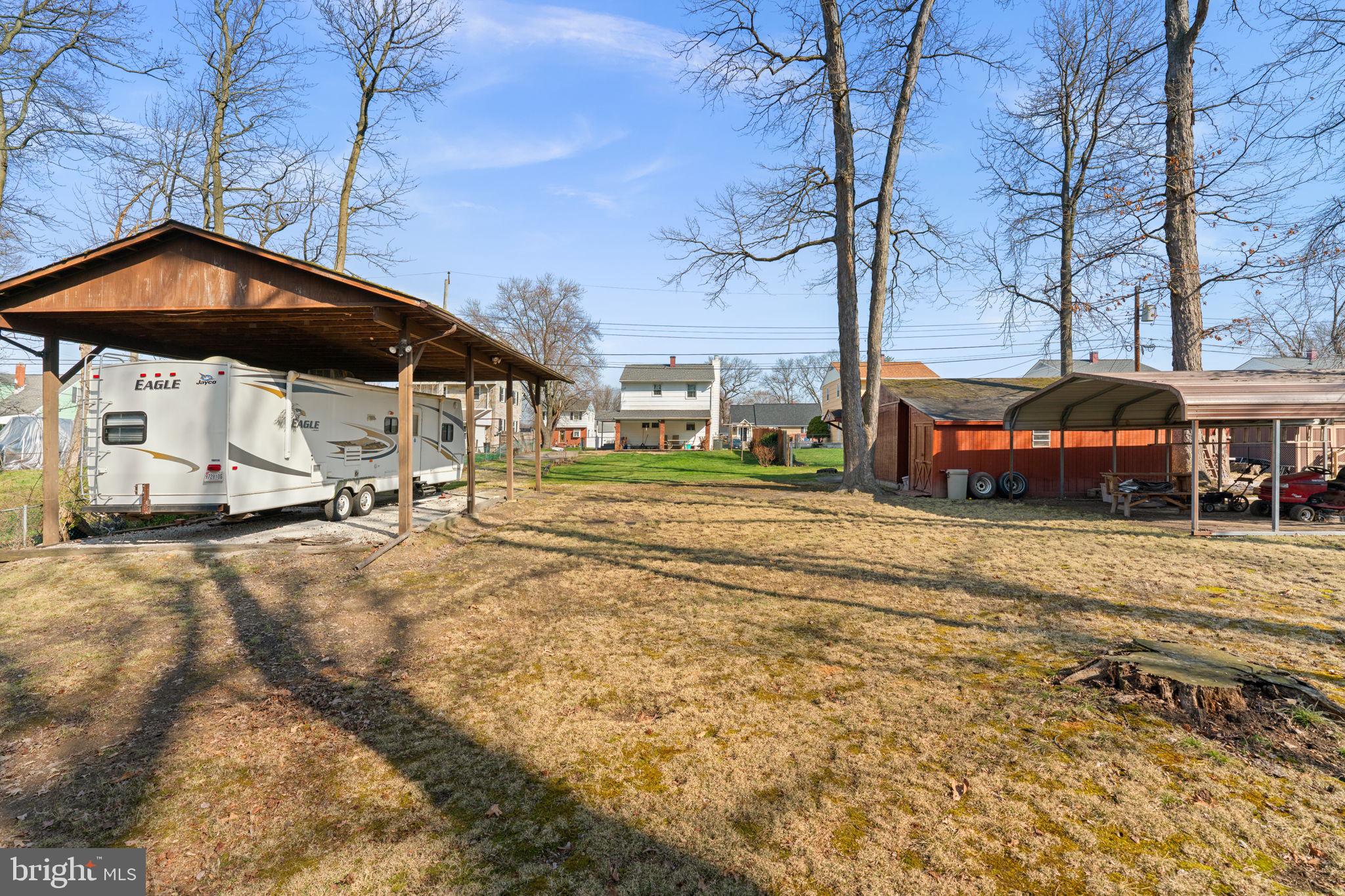 943 Homberg Avenue Baltimore, MD 21221 - Photo 32 of 34 a view of a house with a yard and sitting area