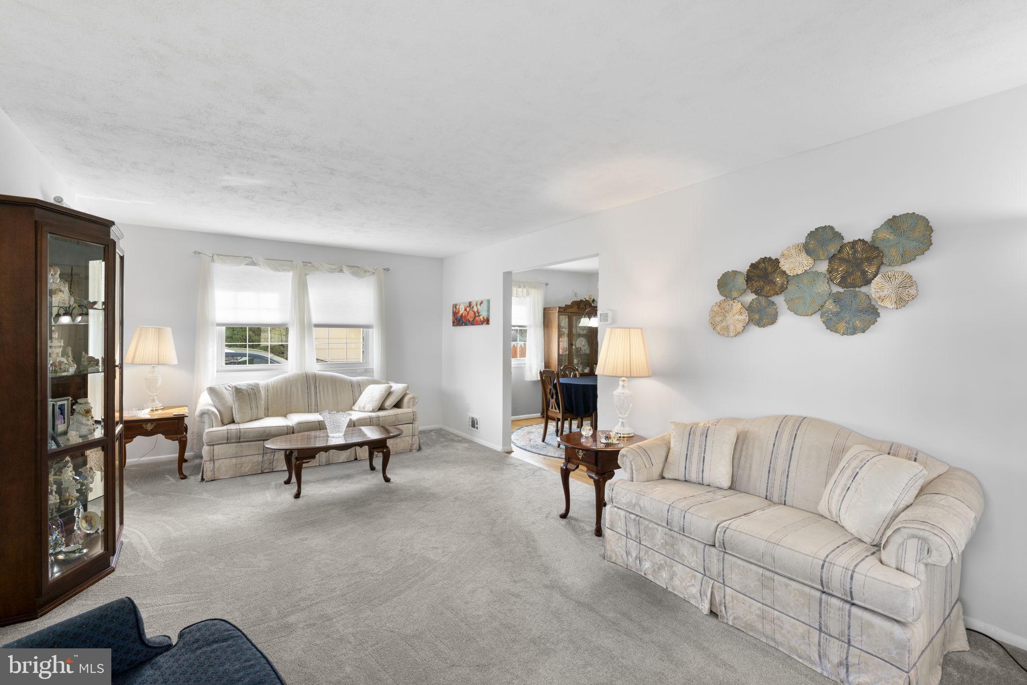 943 Homberg Avenue Baltimore, MD 21221 - Photo 6 of 34 a living room with furniture and a large window