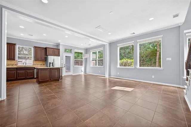 a view of a kitchen with a sink and a window