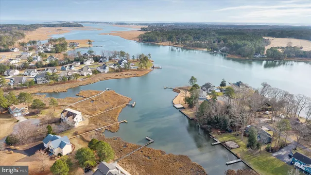 an aerial view of a house with a lake view
