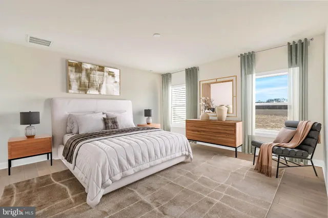 a bathroom with a granite countertop sink a toilet and a mirror