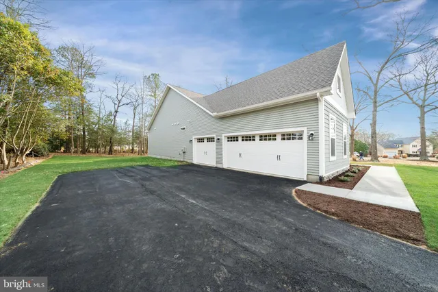 a view of garage and yard