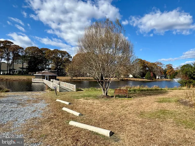 a view of a lake with houses with outdoor space