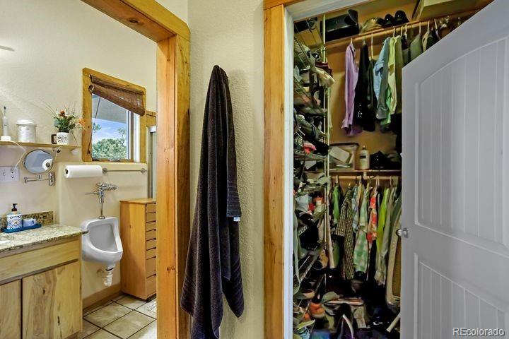 538 Rugby Mines Road Walsenburg, CO 81089 - Photo 20 of 50 a view of walk in closet with clothes and shoes