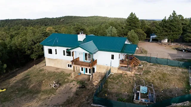 an aerial view of a house with a garden