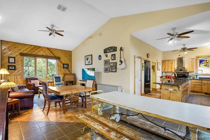 538 Rugby Mines Road Walsenburg, CO 81089 - Photo 28 of 50 a living room with furniture a chandelier and a dining table