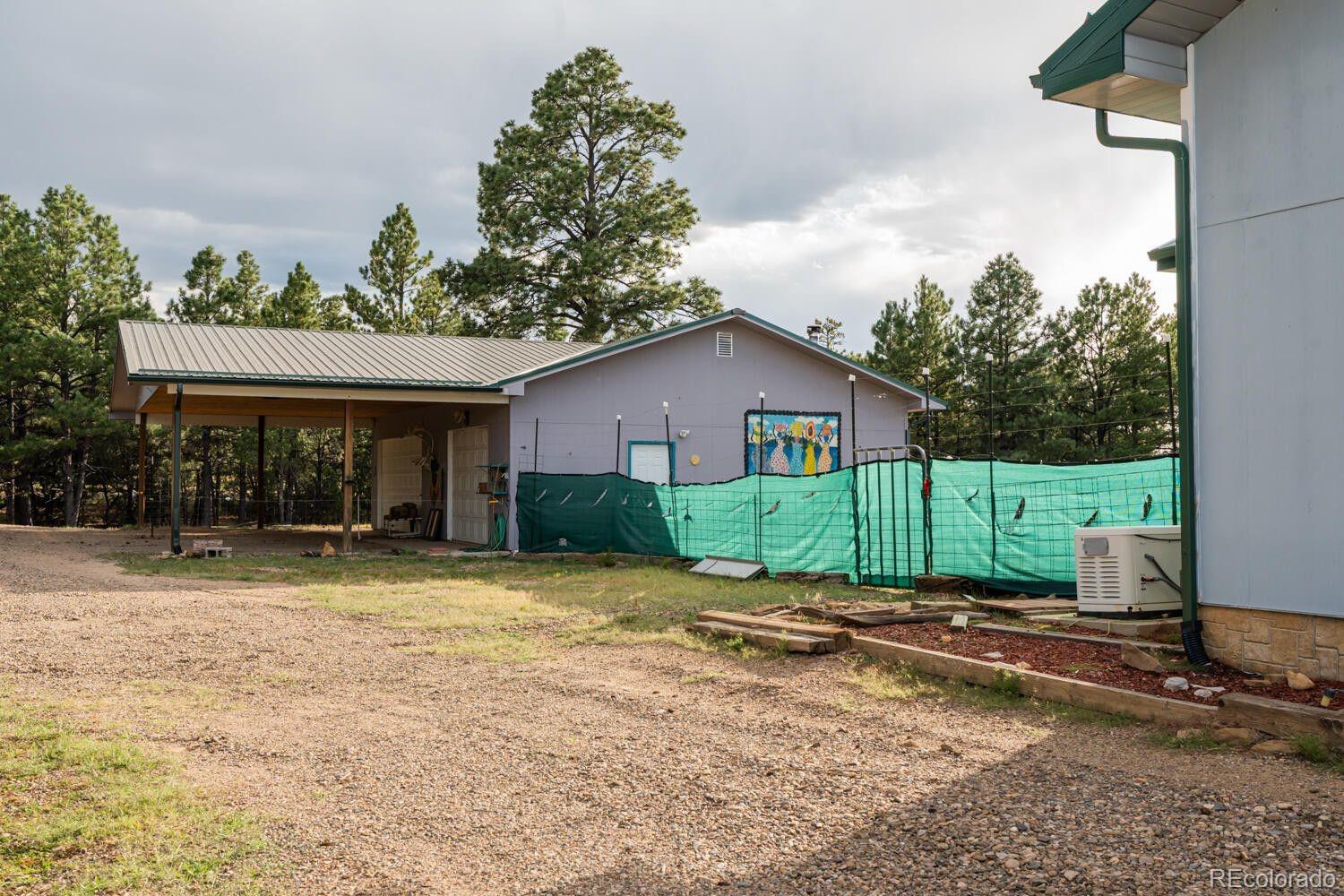 538 Rugby Mines Road Walsenburg, CO 81089 - Photo 46 of 50 a view of a house with backyard and garden