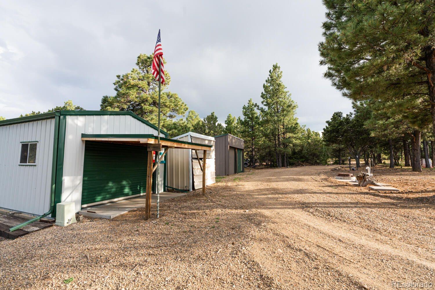 538 Rugby Mines Road Walsenburg, CO 81089 - Photo 48 of 50 a view of a house with a yard and garage