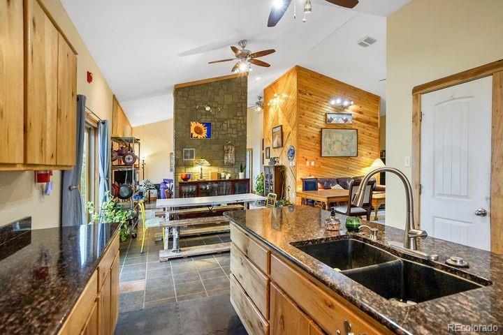 538 Rugby Mines Road Walsenburg, CO 81089 - Photo 10 of 50 a kitchen with a sink stove and cabinets