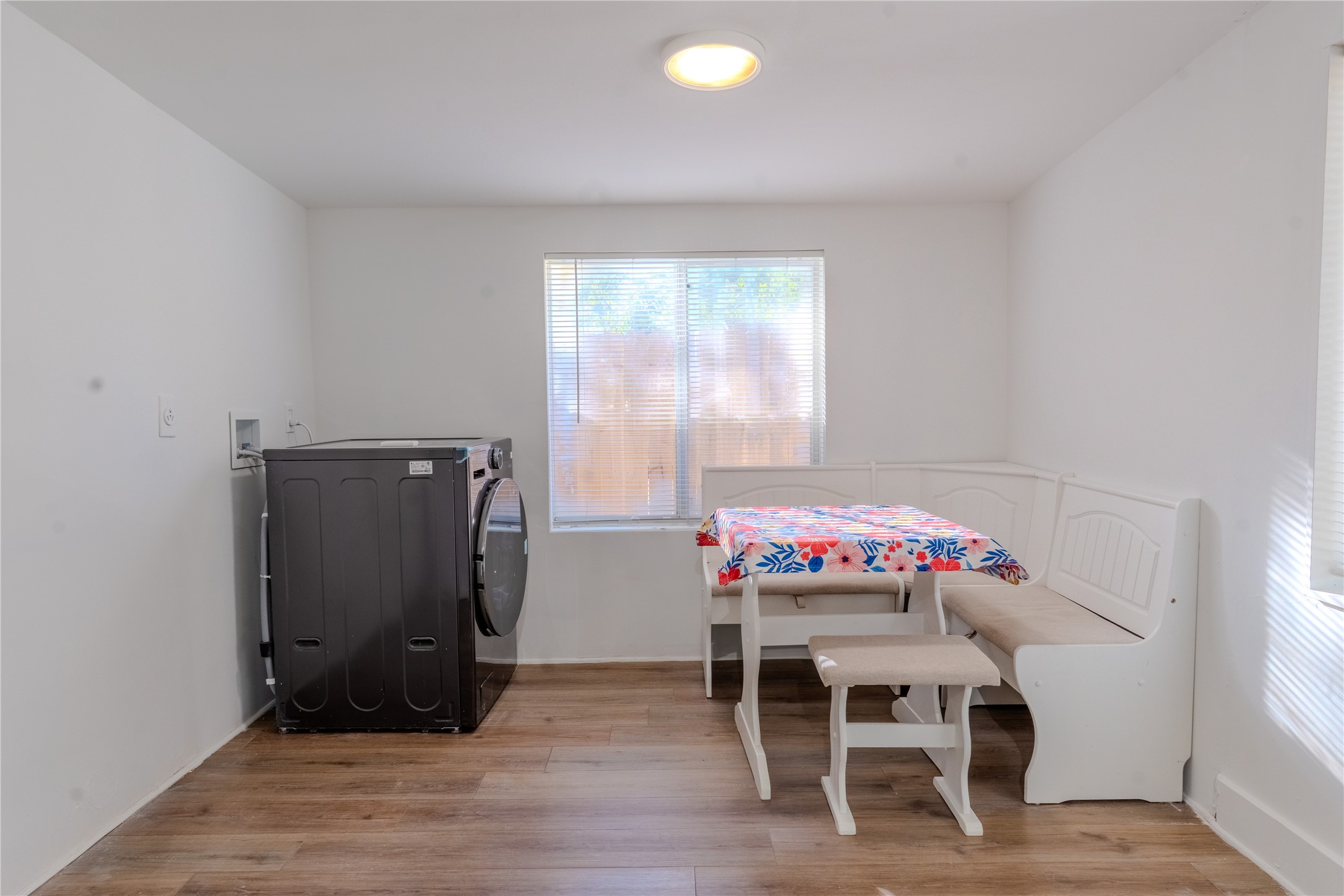 1120 Mark Street Austin, TX 78721 - Photo 14 of 22 Warm wood flooring pairs beautifully with clean white walls and abundant natural light.