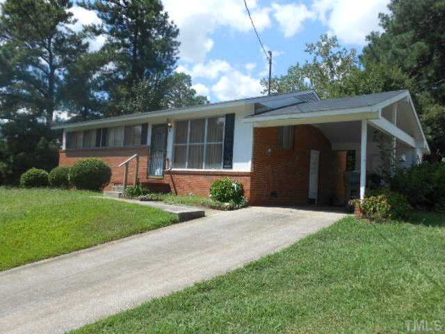 2024 Waters Drive Raleigh, NC 27610 - Photo 5 of 19 front view of a house with a yard and potted plants