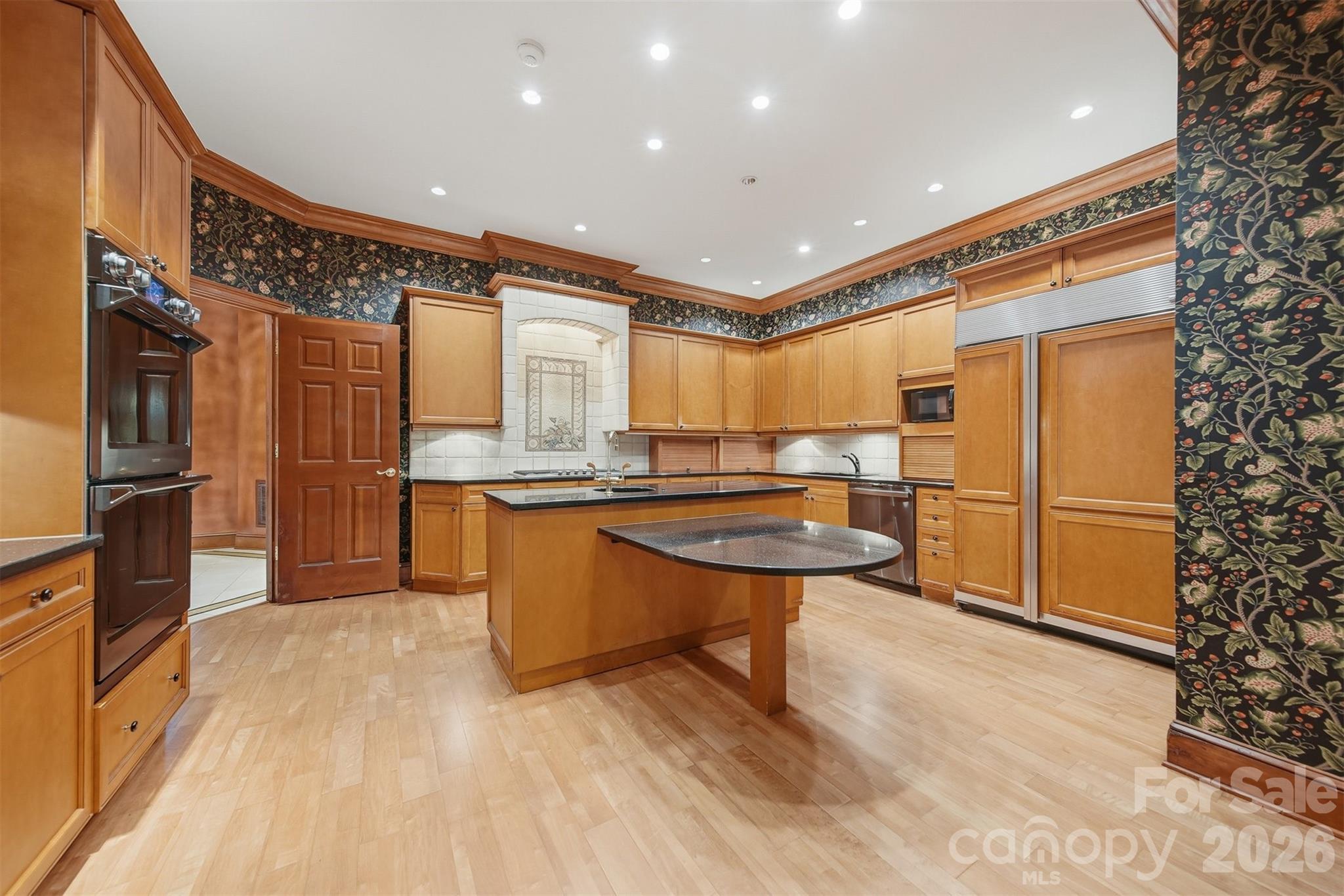 3619 Links Drive Conover, NC 28613 - Photo 18 of 48 a kitchen with stainless steel appliances granite countertop a refrigerator a sink and a stove