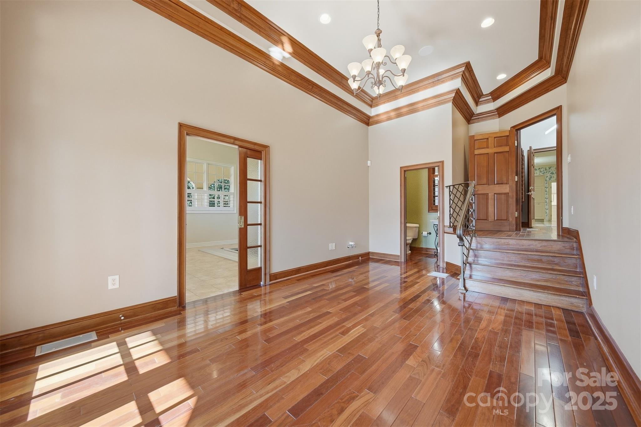3619 Links Drive Conover, NC 28613 - Photo 22 of 48 a view of a livingroom with wooden floor and stairs