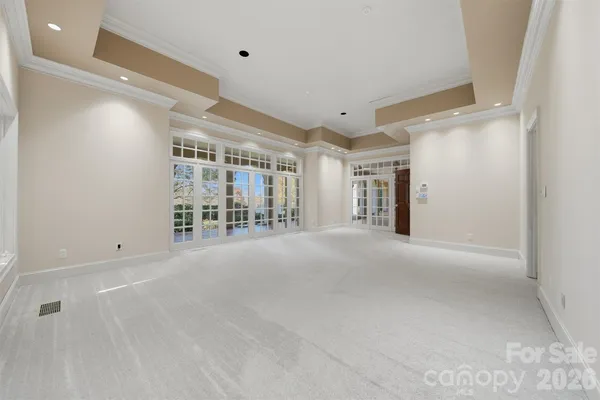 a room with view of kitchen island dining table and chairs