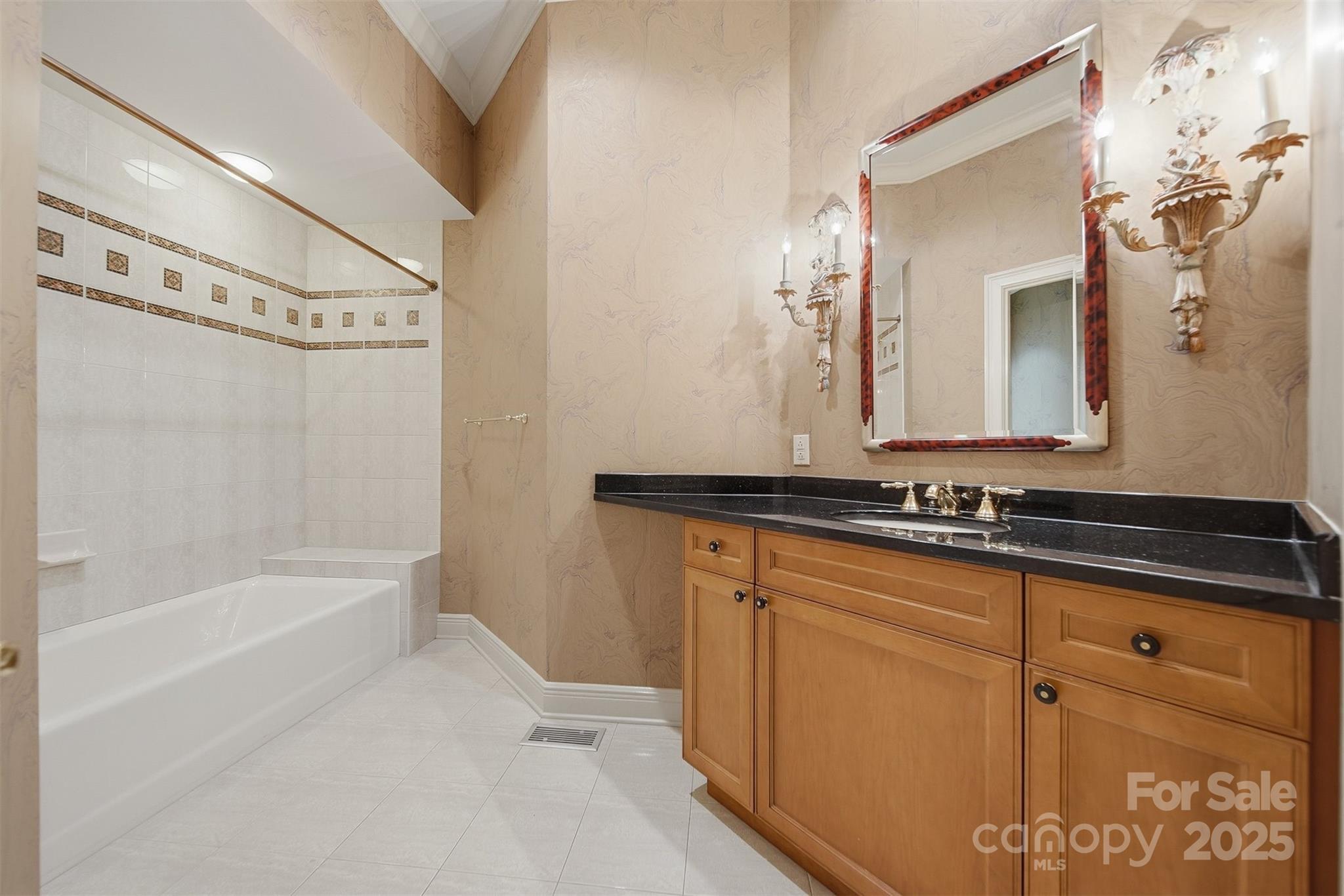 3619 Links Drive Conover, NC 28613 - Photo 25 of 48 a bathroom with a granite countertop sink mirror and a bathtub