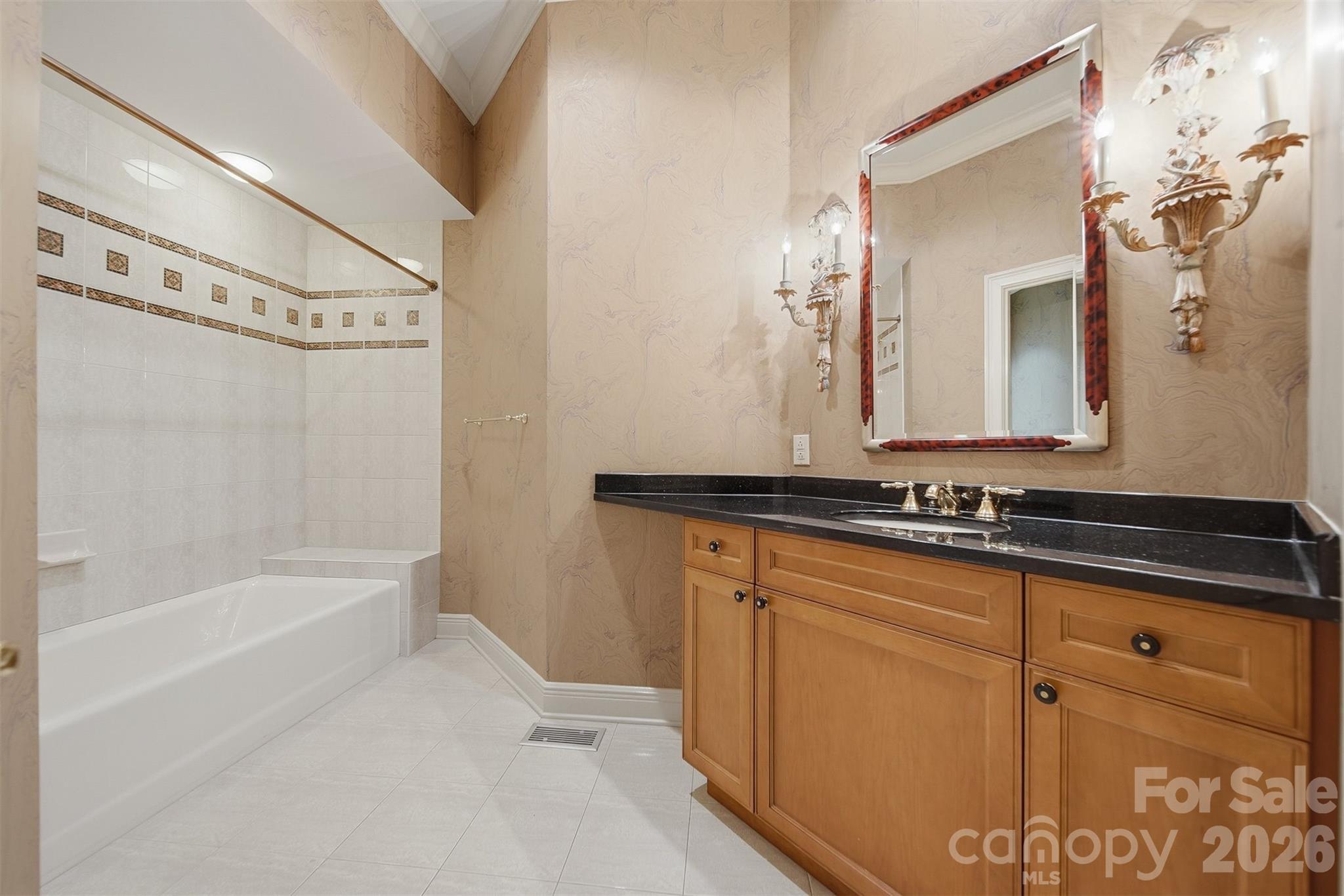 3619 Links Drive Conover, NC 28613 - Photo 28 of 48 a bathroom with a granite countertop sink mirror and a bathtub