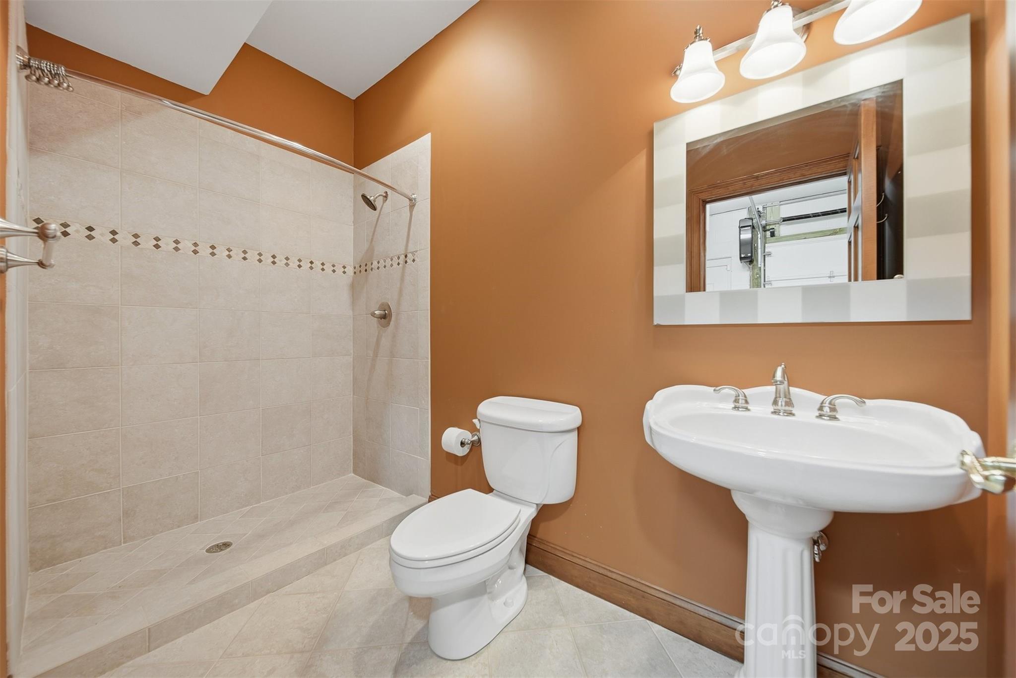 3619 Links Drive Conover, NC 28613 - Photo 39 of 48 a bathroom with a sink mirror toilet and shower