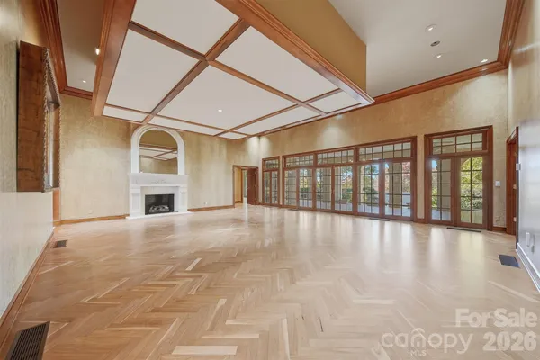 a view of a dining room with furniture and a chandelier