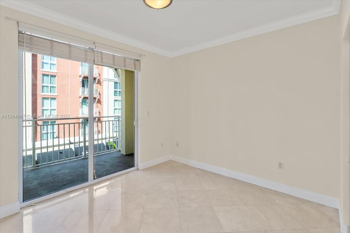 7275 Southwest 90th Street, Unit C310 Miami, FL 33156 - Photo 11 of 40 a view of empty room with floor to ceiling window