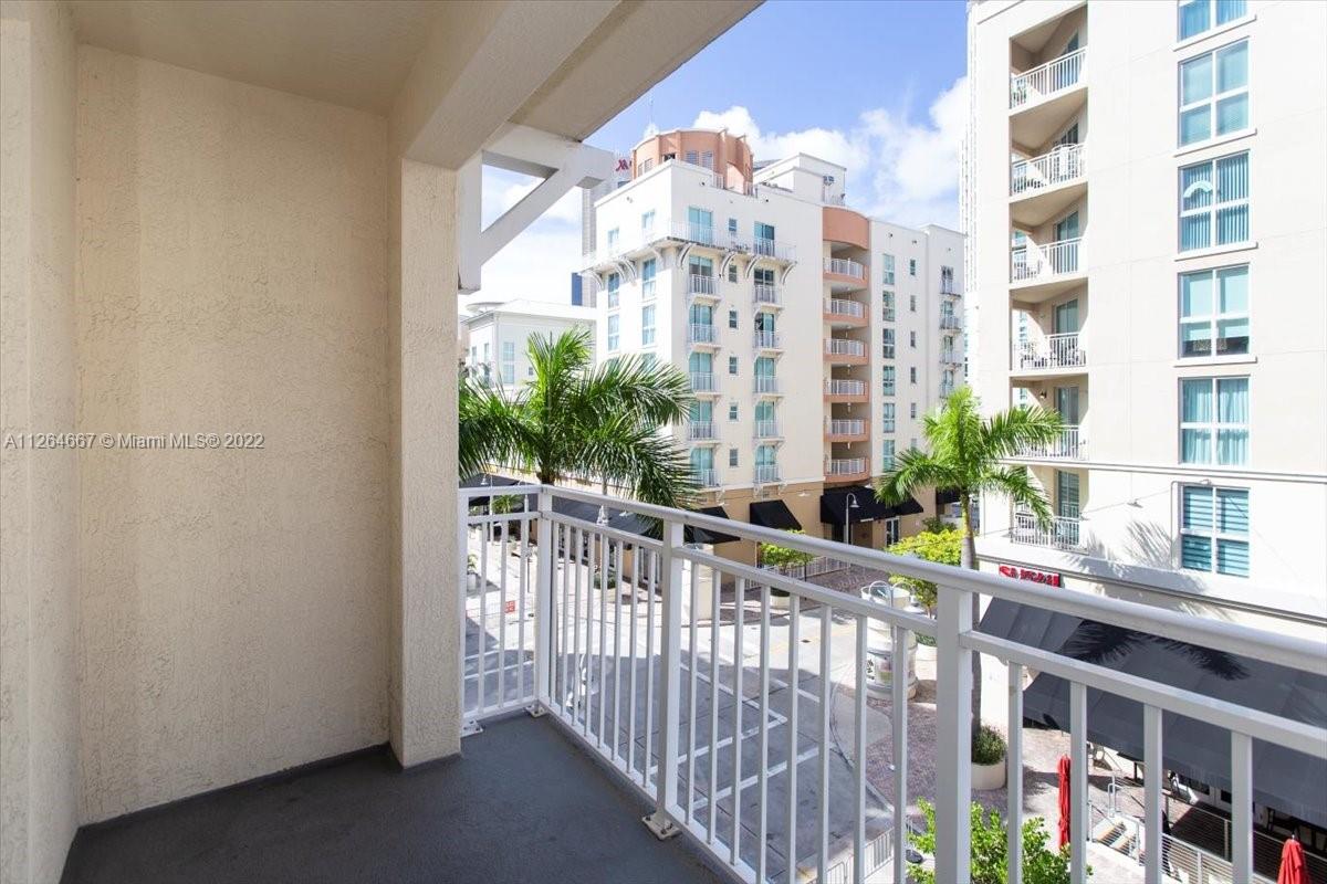 7275 Southwest 90th Street, Unit C310 Miami, FL 33156 - Photo 13 of 40 a view of a building from a balcony