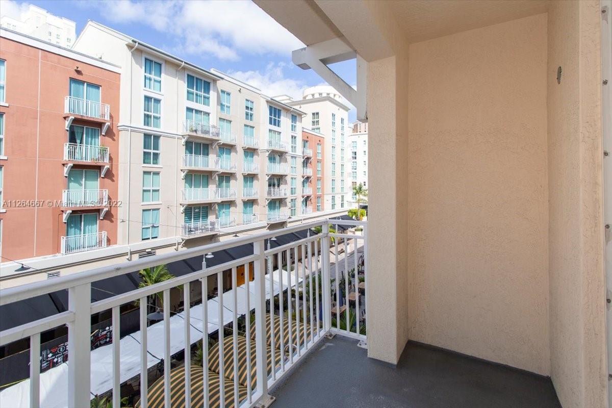 7275 Southwest 90th Street, Unit C310 Miami, FL 33156 - Photo 14 of 40 a view of a building from a balcony