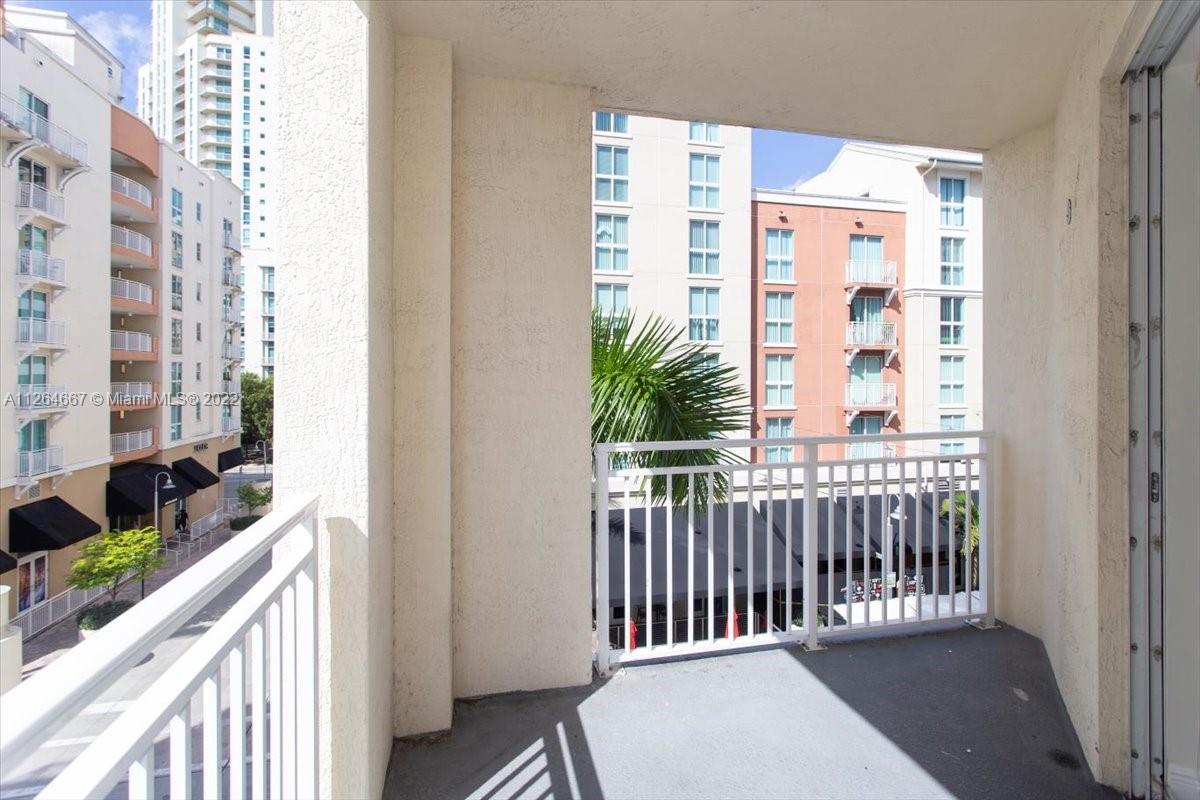 7275 Southwest 90th Street, Unit C310 Miami, FL 33156 - Photo 19 of 40 a view of a balcony with wooden floor