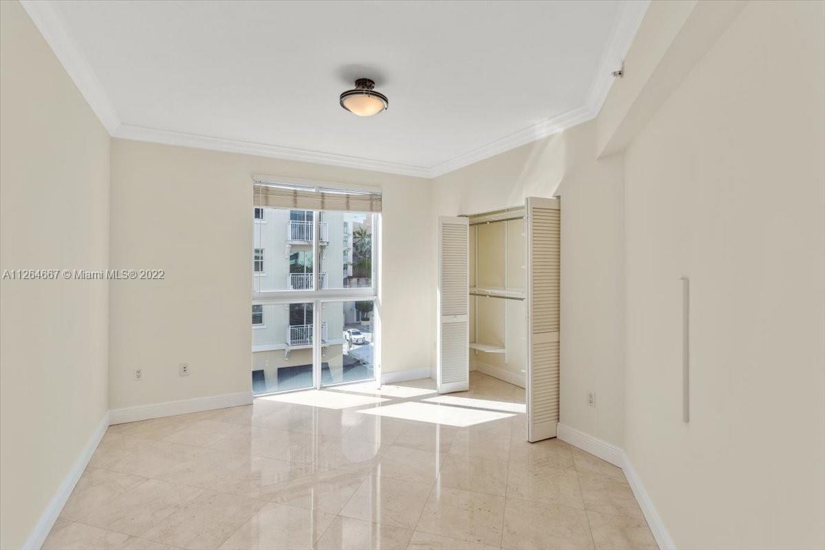7275 Southwest 90th Street, Unit C310 Miami, FL 33156 - Photo 20 of 40 an empty room with windows