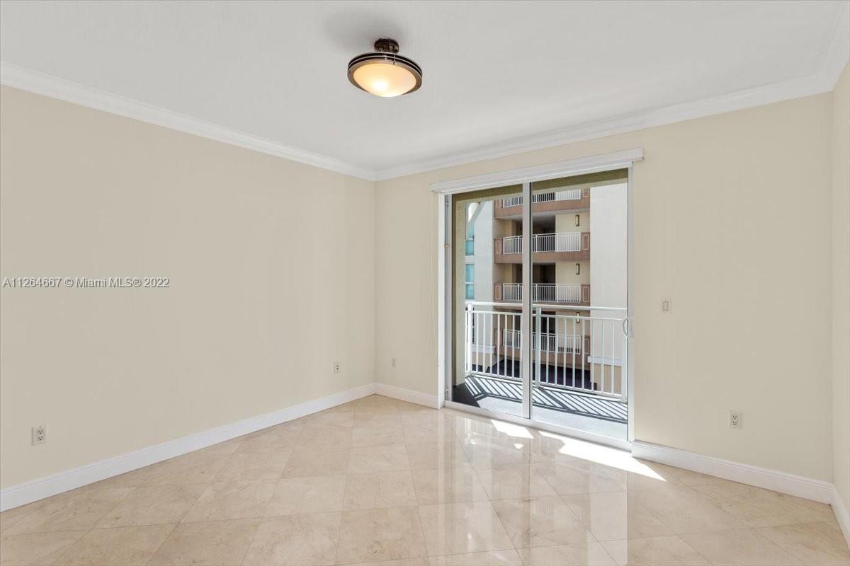 7275 Southwest 90th Street, Unit C310 Miami, FL 33156 - Photo 23 of 40 an empty room with windows