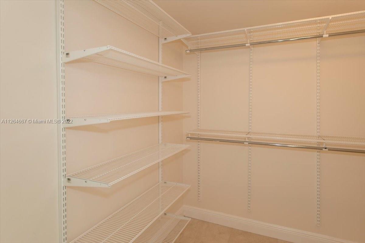 7275 Southwest 90th Street, Unit C310 Miami, FL 33156 - Photo 28 of 40 a view of an empty walk in closet