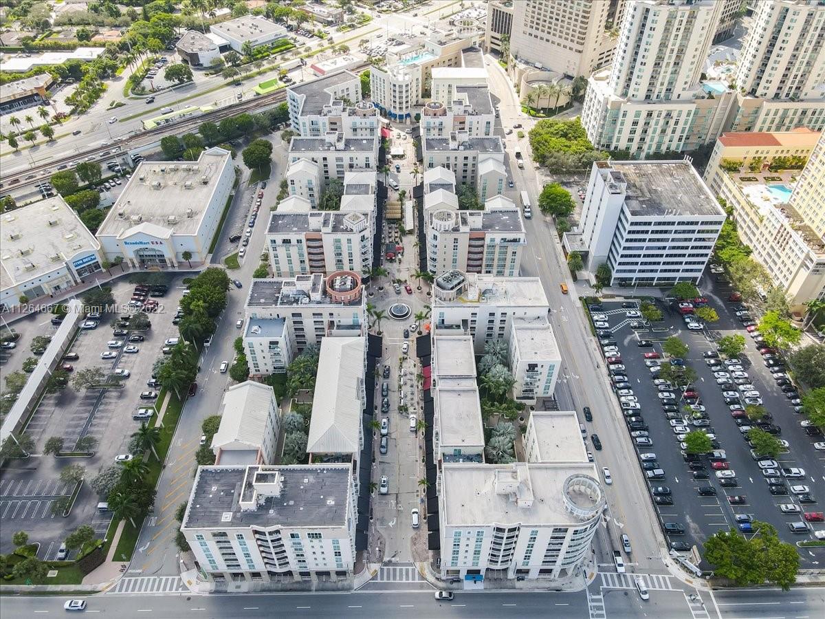 7275 Southwest 90th Street, Unit C310 Miami, FL 33156 - Photo 3 of 40 an aerial view of residential houses with outdoor space