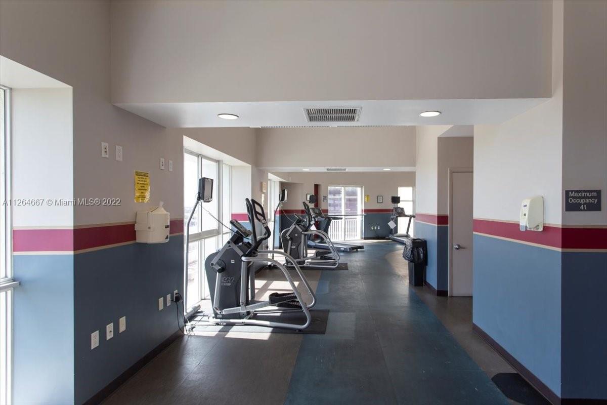 7275 Southwest 90th Street, Unit C310 Miami, FL 33156 - Photo 37 of 40 a view of a room with gym equipment