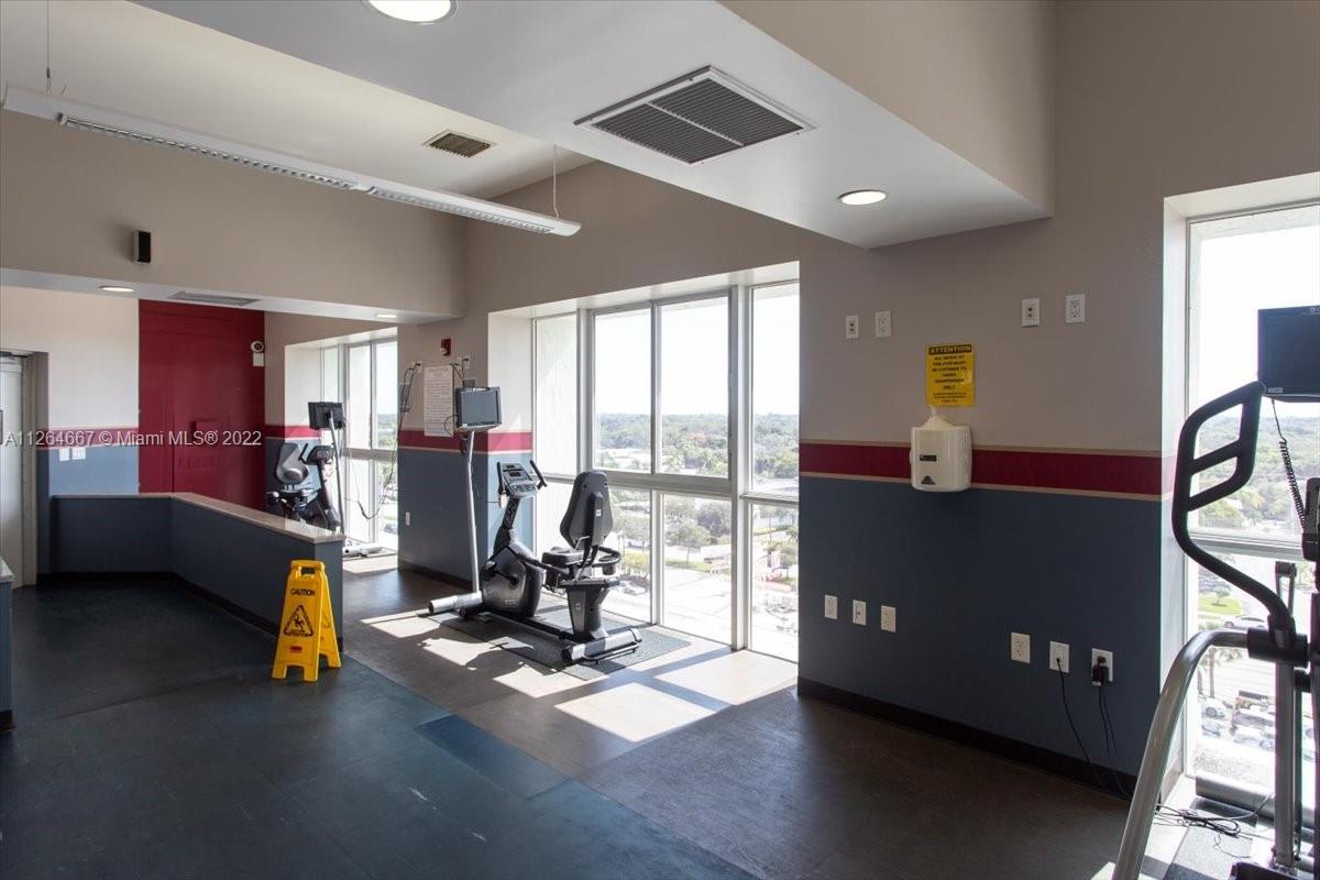7275 Southwest 90th Street, Unit C310 Miami, FL 33156 - Photo 38 of 40 a view of a room with gym equipment