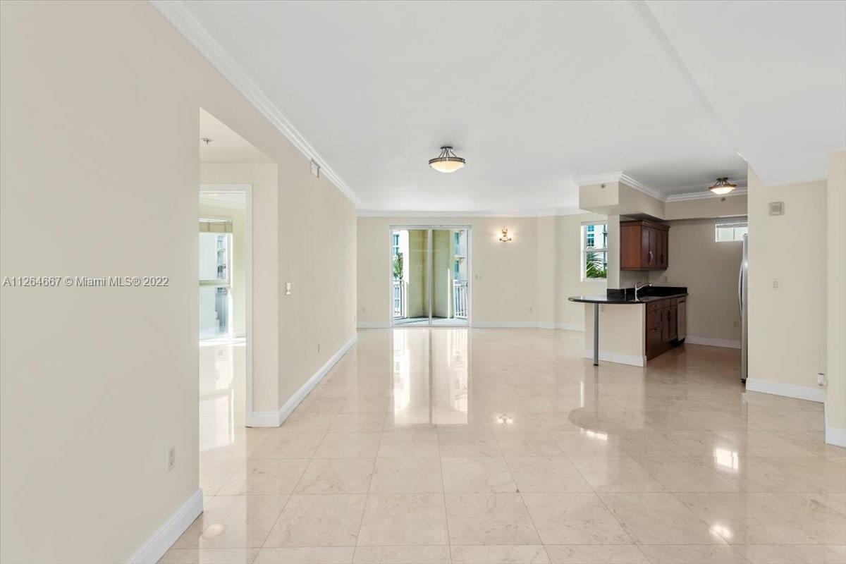 7275 Southwest 90th Street, Unit C310 Miami, FL 33156 - Photo 5 of 40 a view of a kitchen with refrigerator and a sink