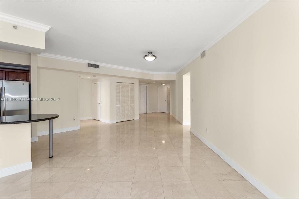 7275 Southwest 90th Street, Unit C310 Miami, FL 33156 - Photo 9 of 40 a view of an empty room with a window