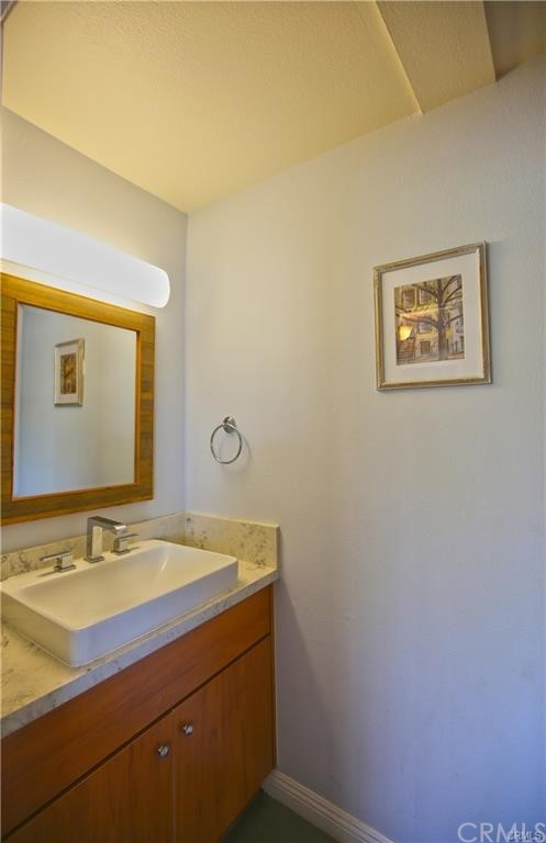 105 East Beacon Street, Unit A Alhambra, CA 91801 - Photo 8 of 15 a bathroom with a sink and a mirror