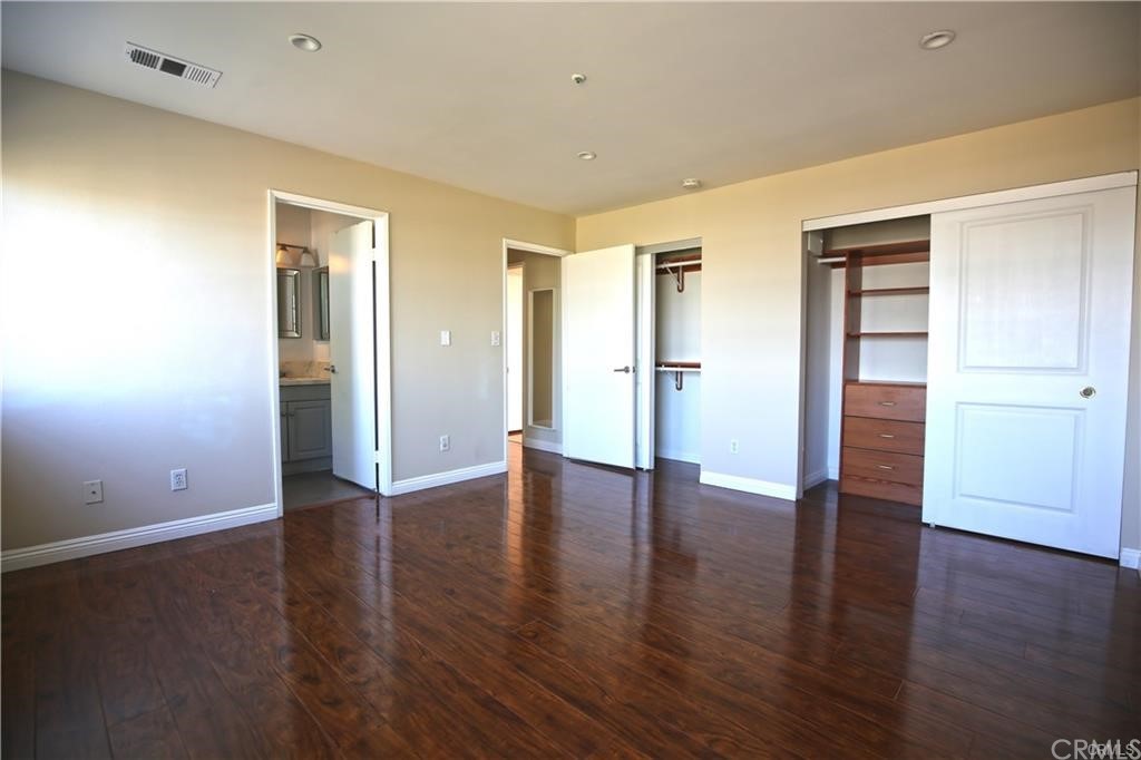 105 East Beacon Street, Unit A Alhambra, CA 91801 - Photo 9 of 15 a view of an empty room with wooden floor