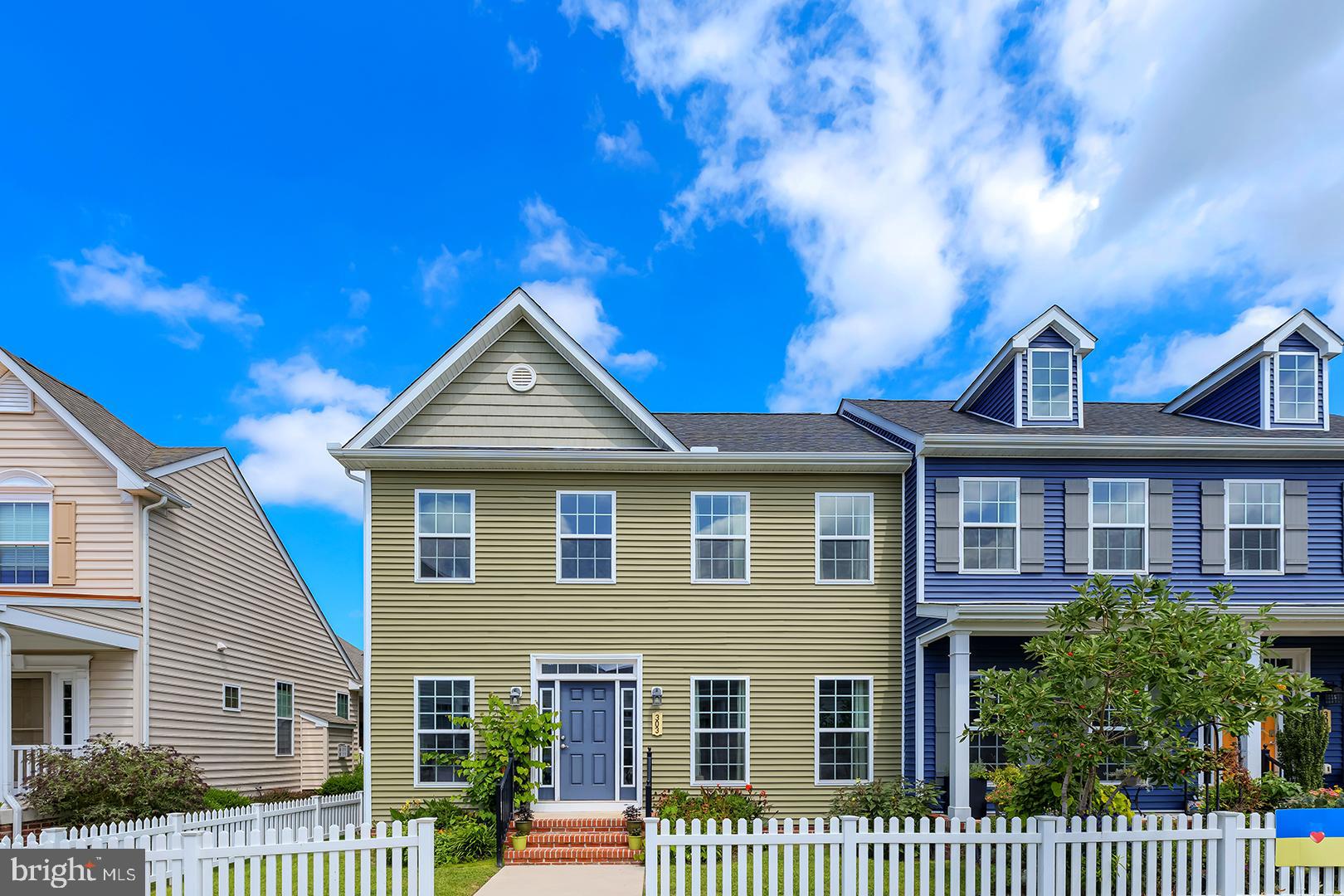 303 Brick Lane Milton, DE 19968 - Photo 1 of 71 a view of a brick house with a small yard