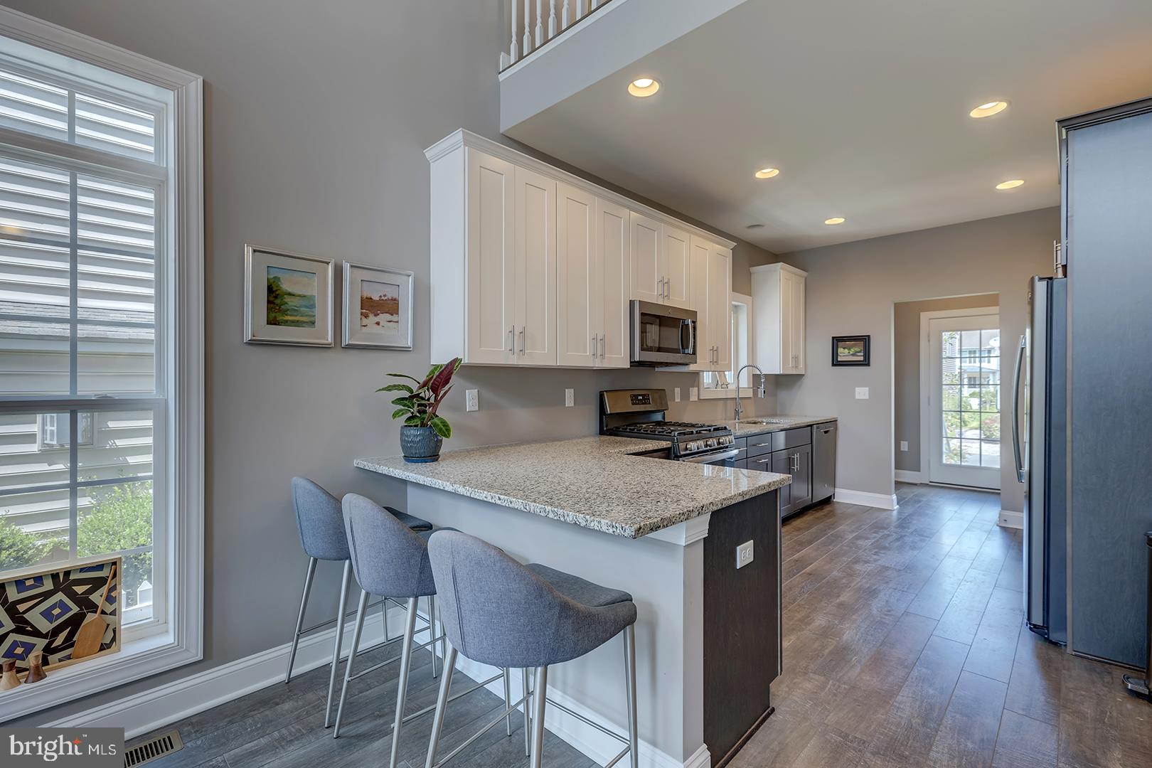 303 Brick Lane Milton, DE 19968 - Photo 13 of 71 a kitchen with appliances a counter space and a window