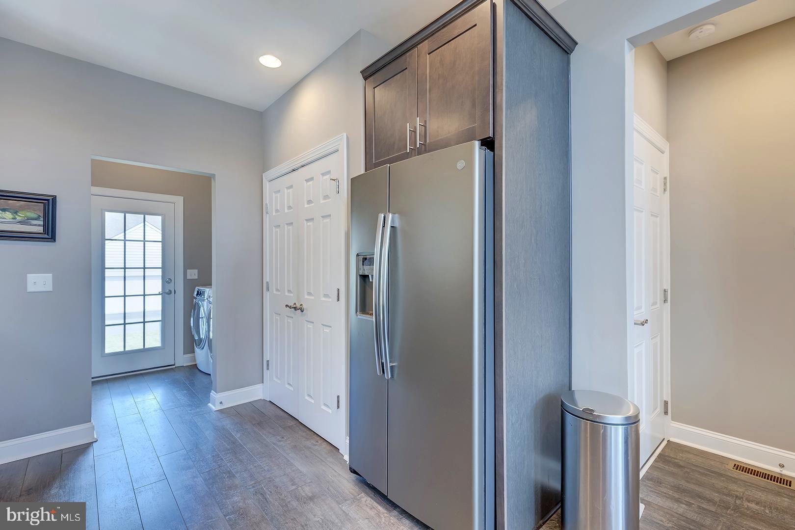 303 Brick Lane Milton, DE 19968 - Photo 18 of 71 a view of entryway with wooden floor