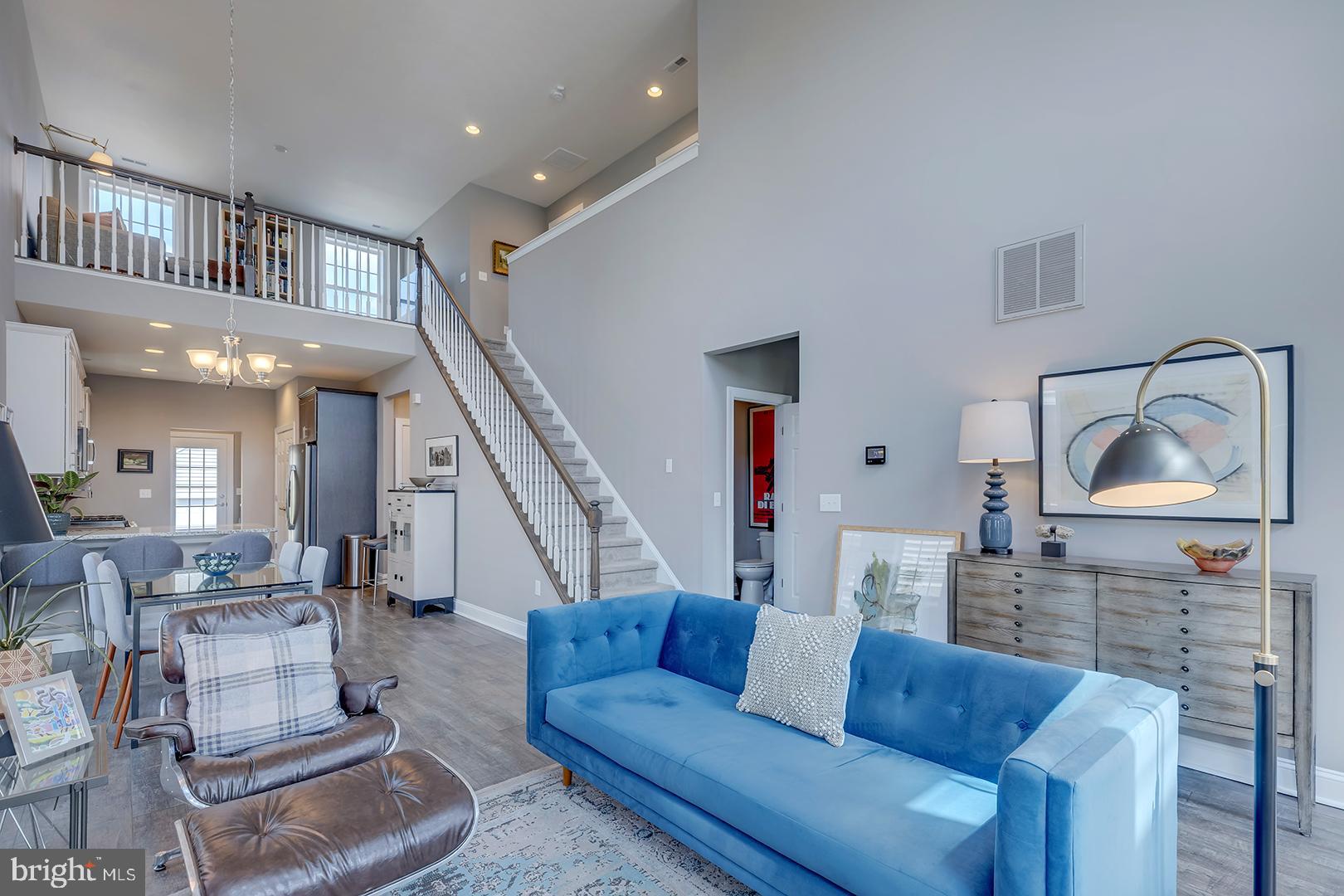 303 Brick Lane Milton, DE 19968 - Photo 22 of 71 a living room with furniture and a wooden floor
