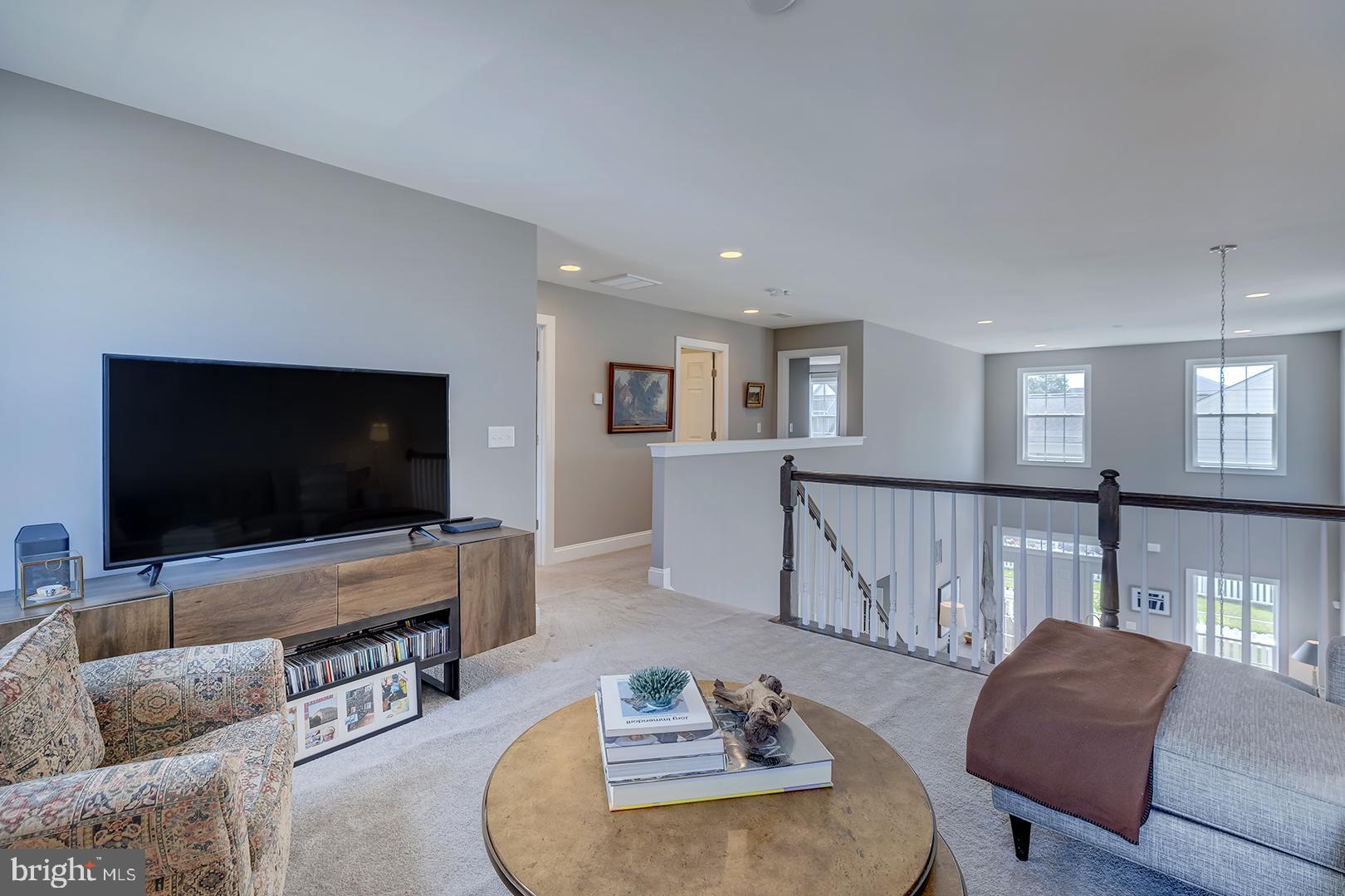 303 Brick Lane Milton, DE 19968 - Photo 25 of 71 a living room with furniture and a flat screen tv